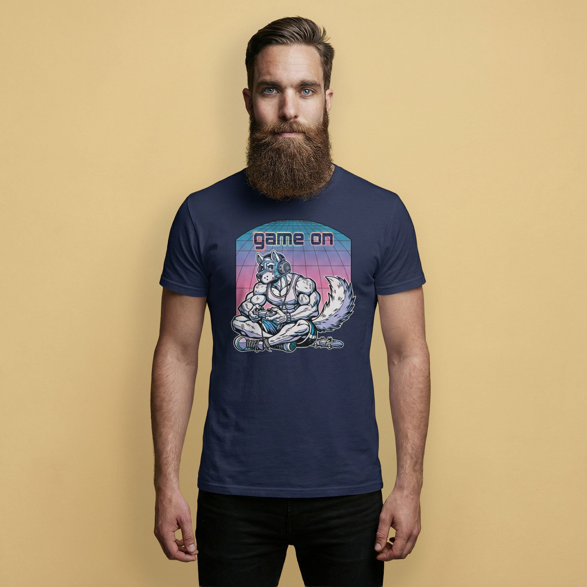 Man wearing a navy blue t-shirt with a Game On Pup graphic design on a beige background – Gamer Gay Pup Play T-Shirt – LGBTQ+ pride t-shirts US UK – Gay pride shirts collection – Made-to-order gay apparel
