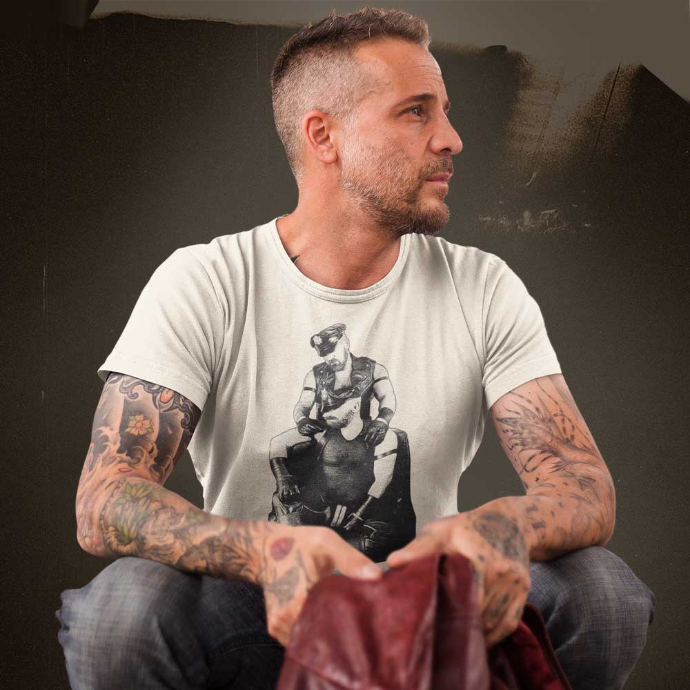Gay man wearing Leather Daddies Shirt-Heather Dust-backroom gear - Leather Pride Daddy T-Shirt – Gay Leather Flag Dom Tee – LGBTQ+ pride t-shirts US UK – Gay pride shirts collection – Made-to-order gay apparel