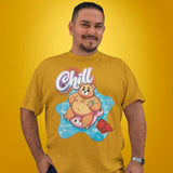 Gay bear wearing a mustard yellow t-shirt with a pool bear graphic and 'Chill' text on a yellow background - Bear Pool Pride T-Shirt | Chubby Bear Graphic Tee – Gay pride shirts collection – LGBTQ+ pride t-shirts US UK – Made-to-order gay apparel