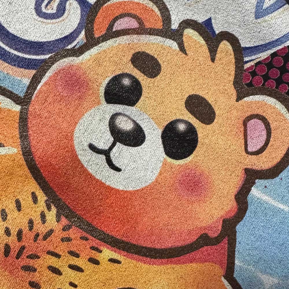 Close up of a t-shirt with a pool bear graphic and 'Chill' text on a beige background - Bear Pool Pride T-Shirt | Chubby Bear Graphic Tee – Gay pride shirts collection – LGBTQ+ pride t-shirts US UK – Made-to-order gay apparel