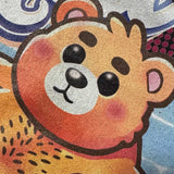 Close up of a t-shirt with a pool bear graphic and 'Chill' text on a beige background - Bear Pool Pride T-Shirt | Chubby Bear Graphic Tee – Gay pride shirts collection – LGBTQ+ pride t-shirts US UK – Made-to-order gay apparel