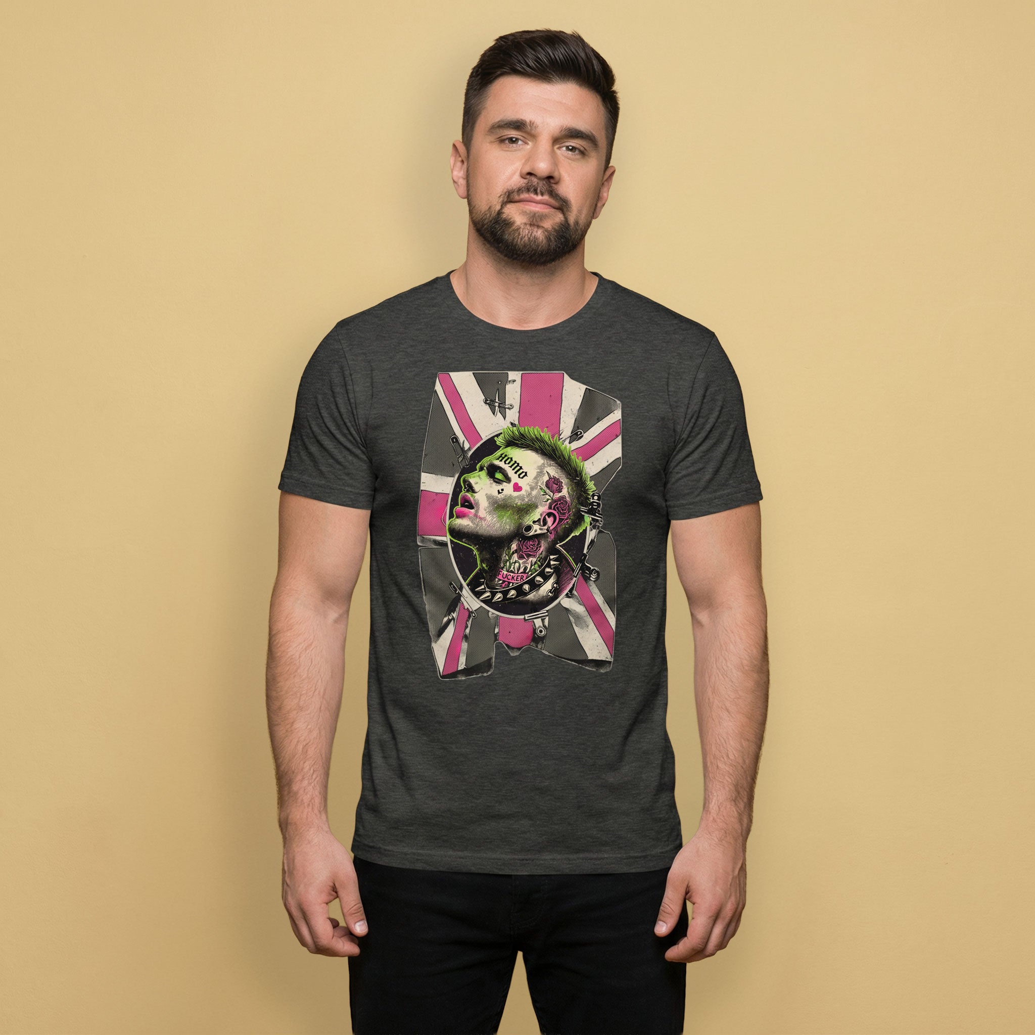 Gay Man wearing a dark gray t-shirt with a homosexual punk pink and green graphic design on a beige background - Grey heather Queer Punk Anthem t-shirt - gay rebel graphic tee by BackRoomGear
