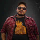 Gay bear wearing Retro Leather Bear Black T-shirt with a vintage-style graphic of a leather-clad bear, sunglasses, and a red plaid shirt - Vintage Leather Bear Pride T-Shirt – Retro Gay Bear Flag Tee – LGBTQ+ pride t-shirts US UK – Gay pride shirts collection – Made-to-order gay apparel