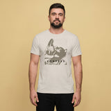 A gay man wearing a vintage white t-shirt with a Sneaker Pup graphic design and 'CONFESS' text