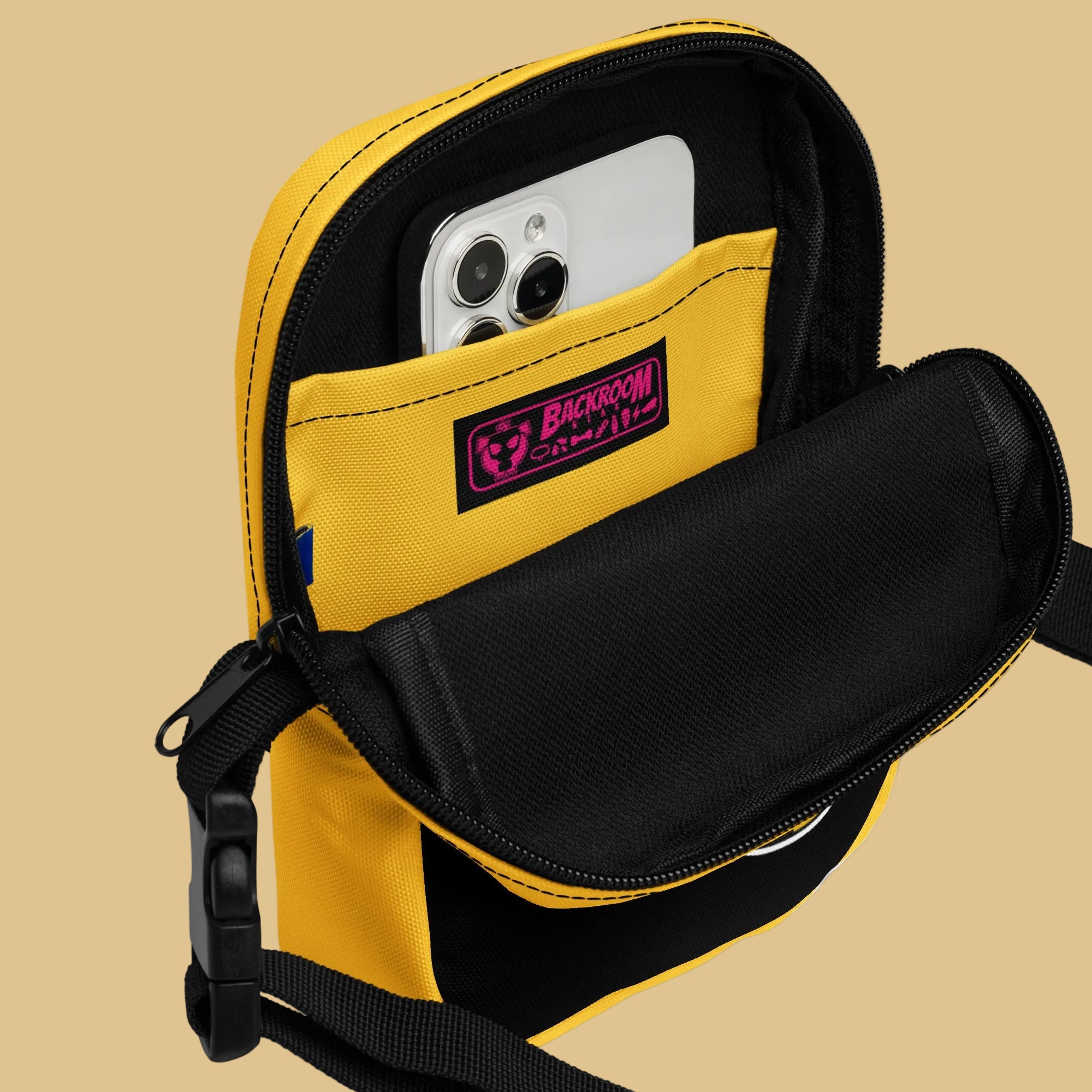 A black and yellow crossbody bag with a watersports hydrant design, featuring multiple pockets and an adjustable shoulder strap. Hydrant Party Essentials crossbody bag - gay pup circuit party bag by BackRoom Gear