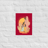 A vintage style poster featuring a sunset with two silhouetted figures, one sitting sucking the one standing, surrounded by cacti, against a red background - Vintage Brokeback Cowboy poster - western gay pride print by BackRoom Gear