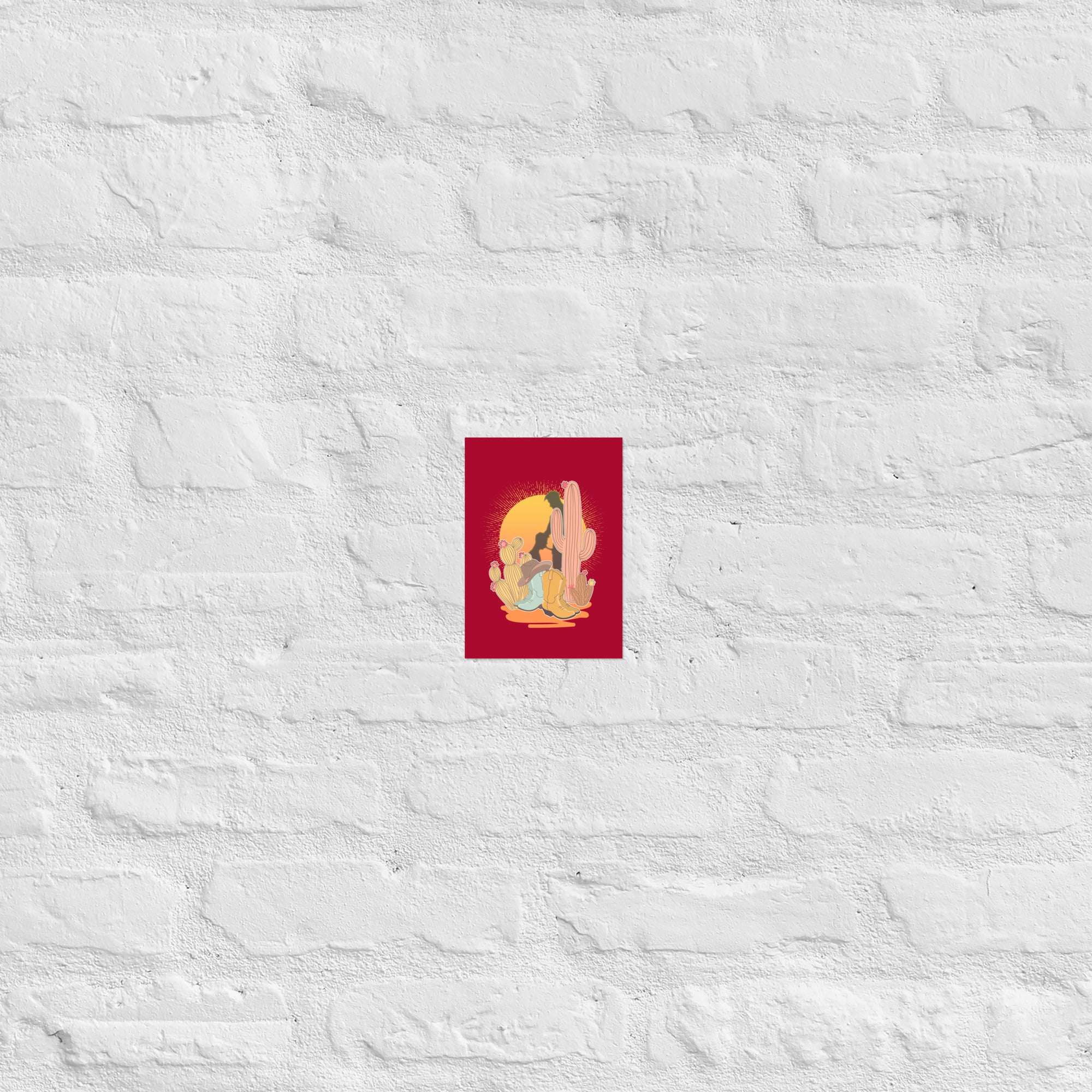 A vintage style poster featuring a sunset with two silhouetted figures, one sitting sucking the one standing, surrounded by cacti, against a red background - Vintage Brokeback Cowboy poster - western gay pride print by BackRoom Gear