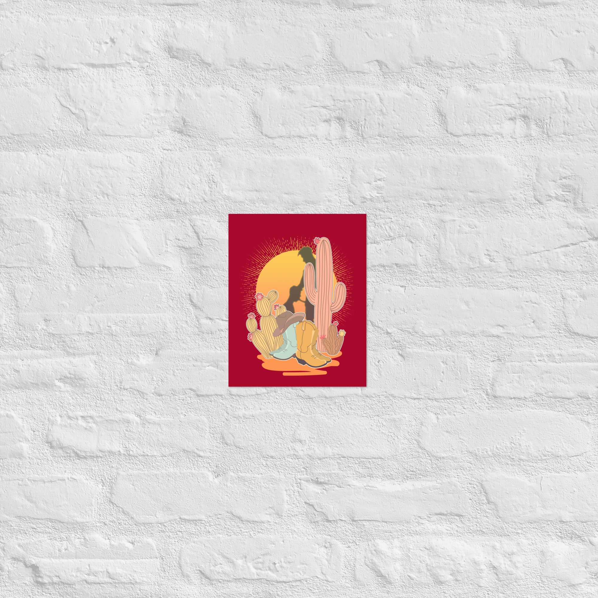 A vintage style poster featuring a sunset with two silhouetted figures, one sitting sucking the one standing, surrounded by cacti, against a red background - Vintage Brokeback Cowboy poster - western gay pride print by BackRoom Gear