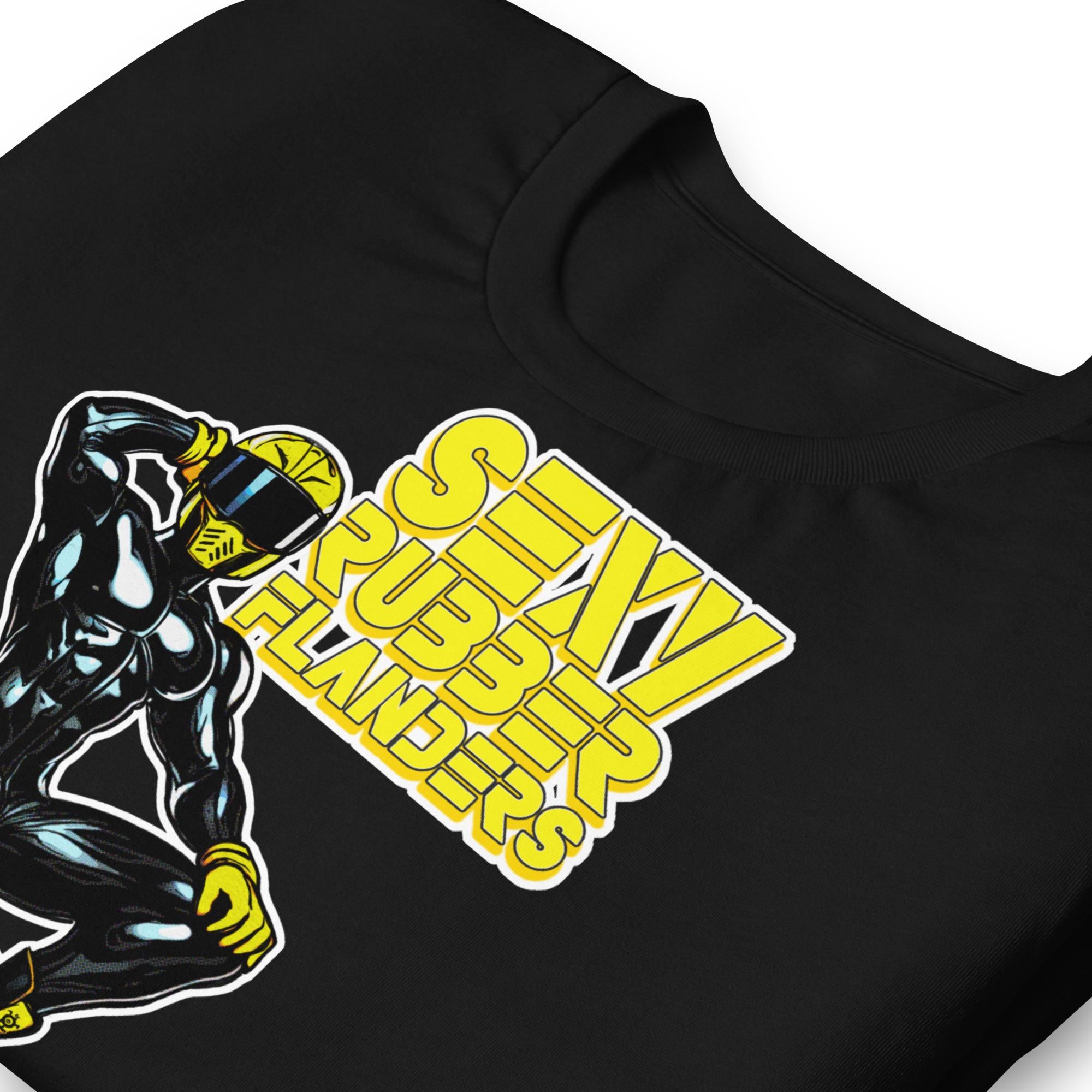 Folded black t-shirt with a man in rubber with yellow helmet and shoes sitting on top of a square barrel of piss graphic design on a beige background - Black and yellow Sexy Rubber Flanders t-shirt - kinky latex rubber kink tee by BackRoomGear