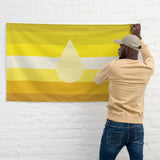Piss Kink Pride Flag being hung by a man, showcasing vibrant yellow and white colors, representing kink pride flag.