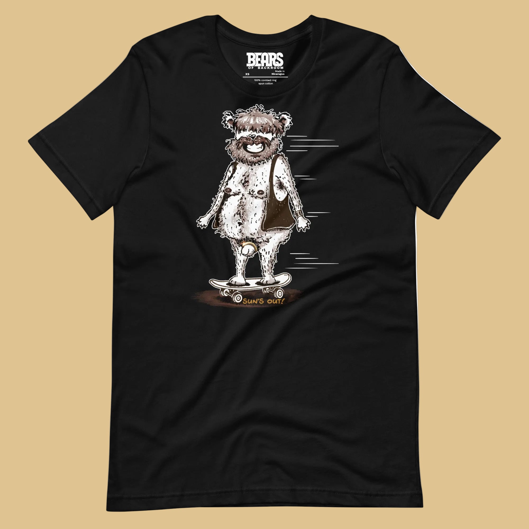 Black Sun’s Out T-Shirt laid flat on beige, featuring a shaggy bear in an open vest riding a skateboard.