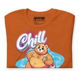 Folded autumn orange t-shirt with a pool bear graphic and 'Chill' text on a yellow background - Bear Pool Pride T-Shirt | Chubby Bear Graphic Tee – Gay pride shirts collection – LGBTQ+ pride t-shirts US UK – Made-to-order gay apparel