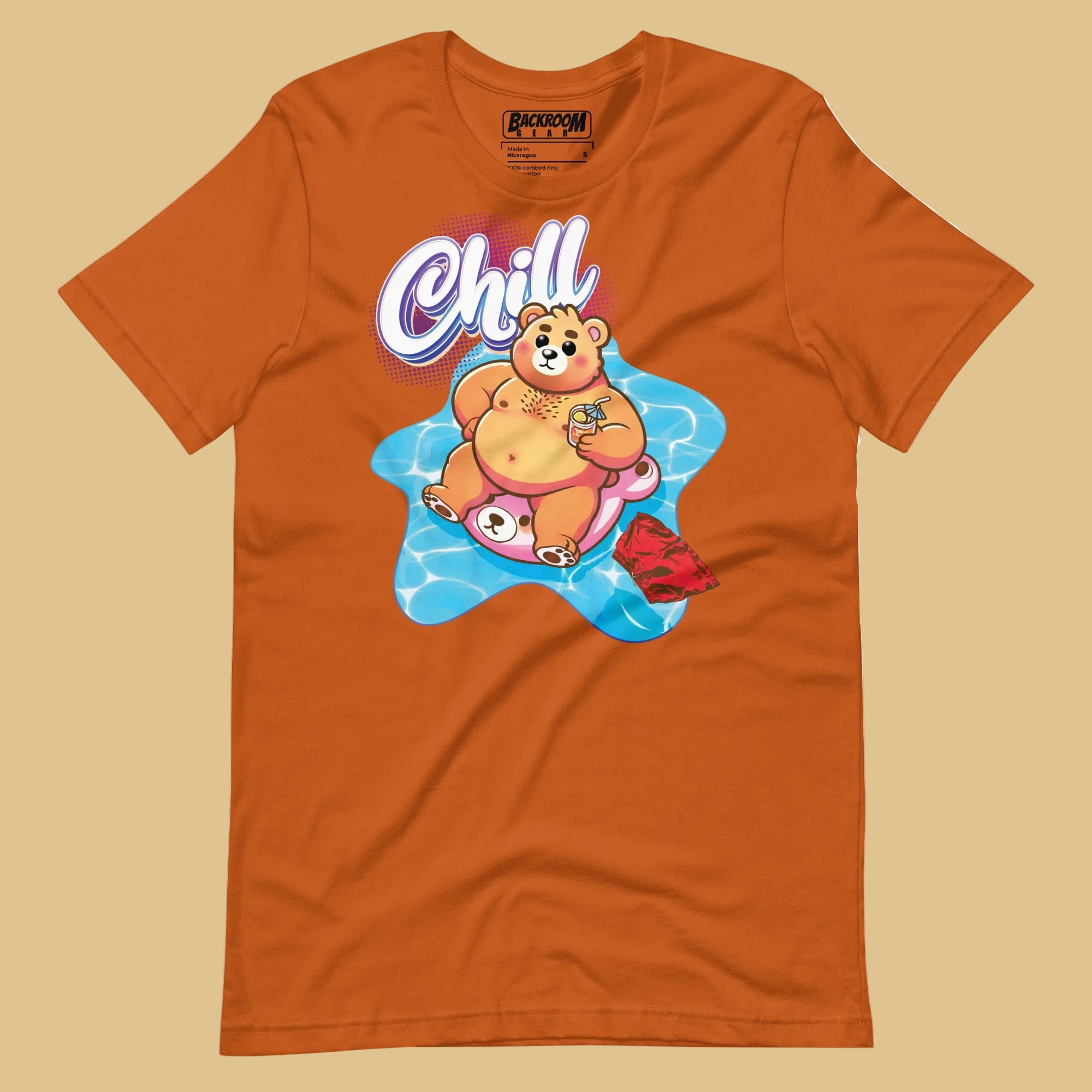 Autumn orange t-shirt with a pool bear graphic and 'Chill' text on a beige background - Bear Pool Pride T-Shirt | Chubby Bear Graphic Tee – Gay pride shirts collection – LGBTQ+ pride t-shirts US UK – Made-to-order gay apparel