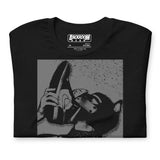 Folded closeup of black t-shirt with a Sneaker Pup graphic design and 'CONFESS' text