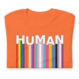 We Are Human Orange T-Shirt Folded - BackRoom Gear - Human Rainbow Heart Pride T-Shirt – LGBTQ+ Love Unity Tee – Inclusive rainbow pride shirt – LGBTQ+ pride t-shirts US UK – Made-to-order LGBTQ clothing