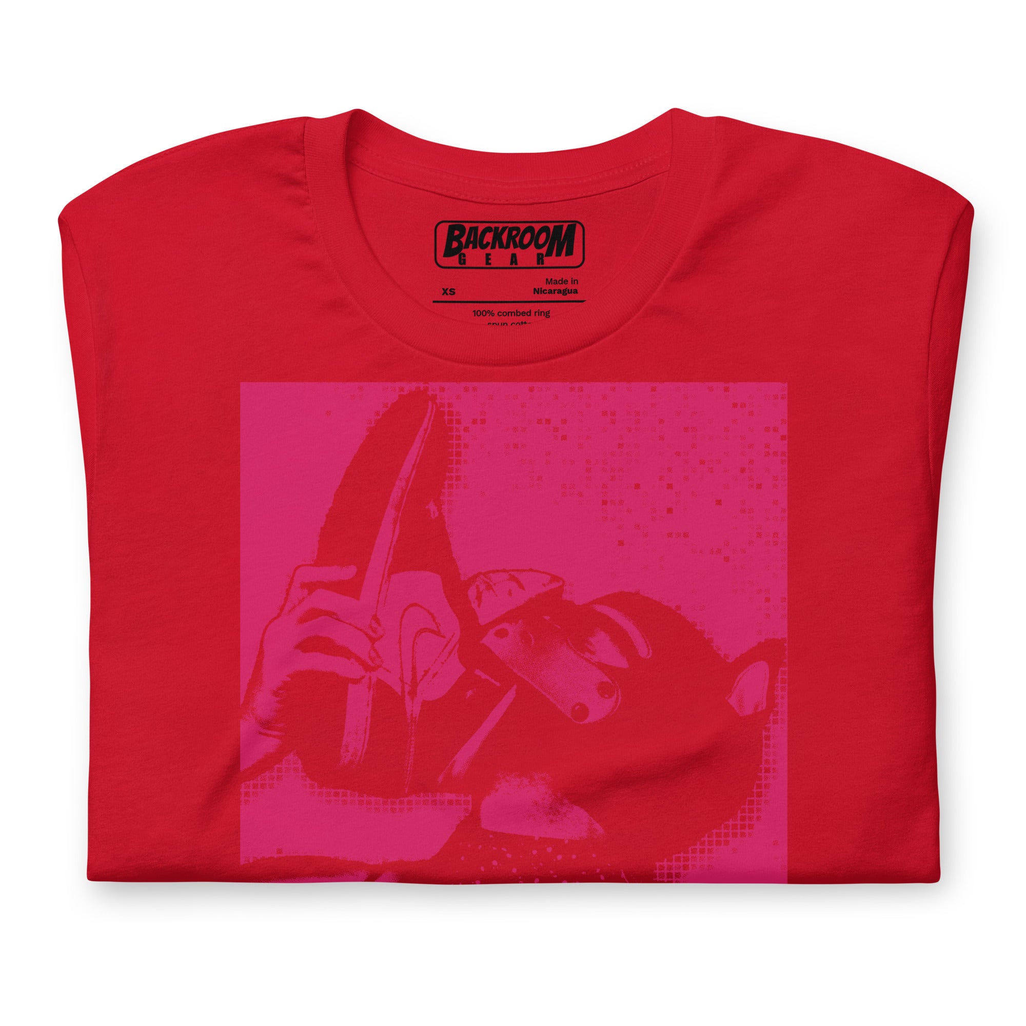 Folded closeup of red t-shirt with a Sneaker Pup graphic design and 'CONFESS' text