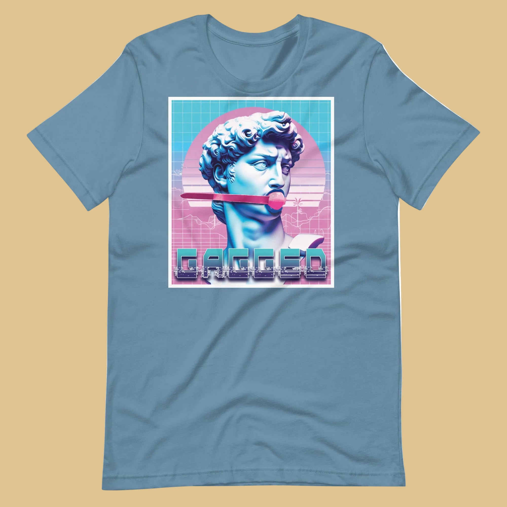 Steel blue shirt featuring a stone statue head gagged by a ball gag with a retro vaporwave background - Gagged t-shirt - bondage kink pride LGBTQ+ gay tee by BackRoomGear
