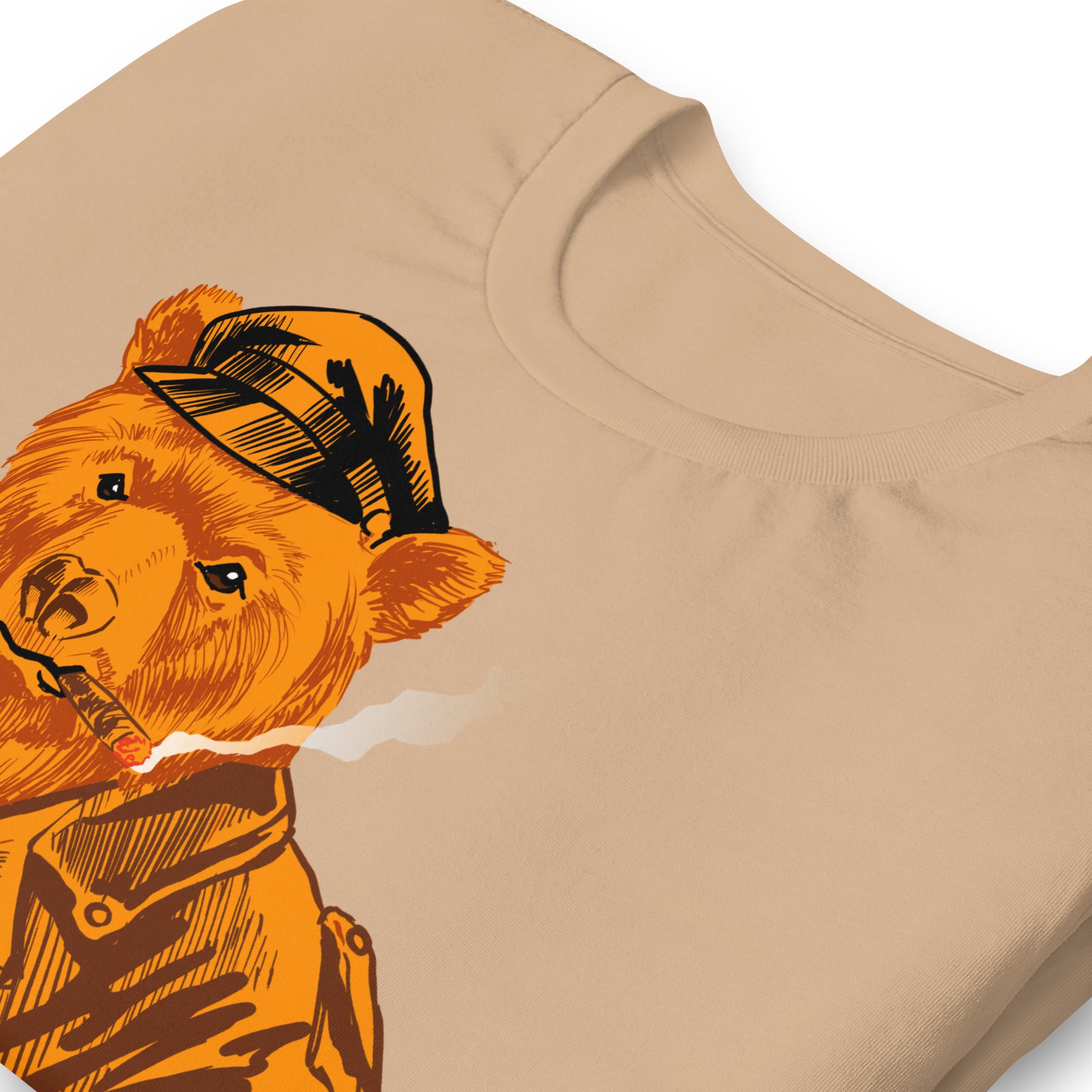 Folded Tan brown T-shirt with a vintage-style graphic of a leather-clad bear - Vintage Leather Bear Pride T-Shirt – Retro Gay Bear Flag Tee – LGBTQ+ pride t-shirts US UK – Gay pride shirts collection – Made-to-order gay apparel
