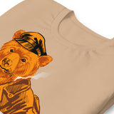 Folded Tan brown T-shirt with a vintage-style graphic of a leather-clad bear - Vintage Leather Bear Pride T-Shirt – Retro Gay Bear Flag Tee – LGBTQ+ pride t-shirts US UK – Gay pride shirts collection – Made-to-order gay apparel