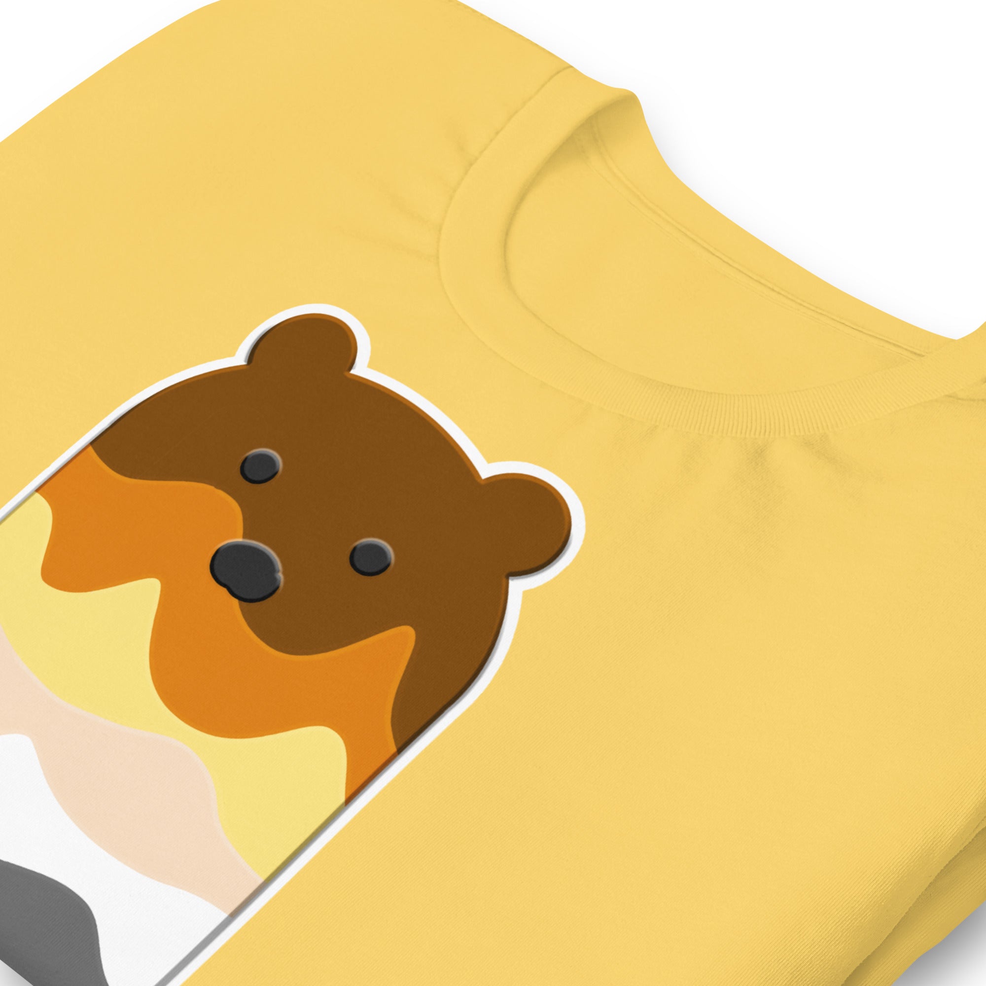 Close-up detail of yellow t-shirt with a bear popsicle graphic on a white background - Bear Paddle Pop T-Shirt – Gay Bear Pride Flag Parody Tee – LGBTQ+ pride t-shirts US UK – Gay pride shirts collection – Made-to-order gay apparel