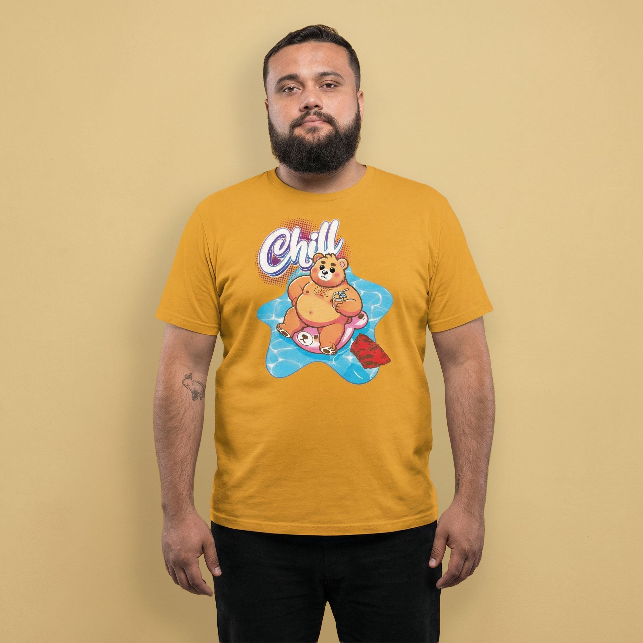 Gay bear wearing a mustard yellow t-shirt with a pool bear graphic and 'Chill' text on a beige background - Bear Pool Pride T-Shirt | Chubby Bear Graphic Tee – Gay pride shirts collection – LGBTQ+ pride t-shirts US UK – Made-to-order gay apparel