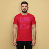 A gay man wearing a red t-shirt with a Sneaker Pup graphic design and 'CONFESS' text