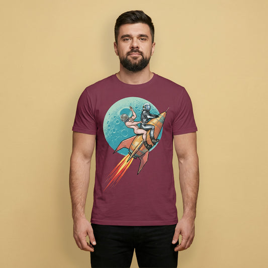 Man wearing a maroon t-shirt with a graphic design of a nude spaceman and a leather spaceman on a rocket ship against a planet.