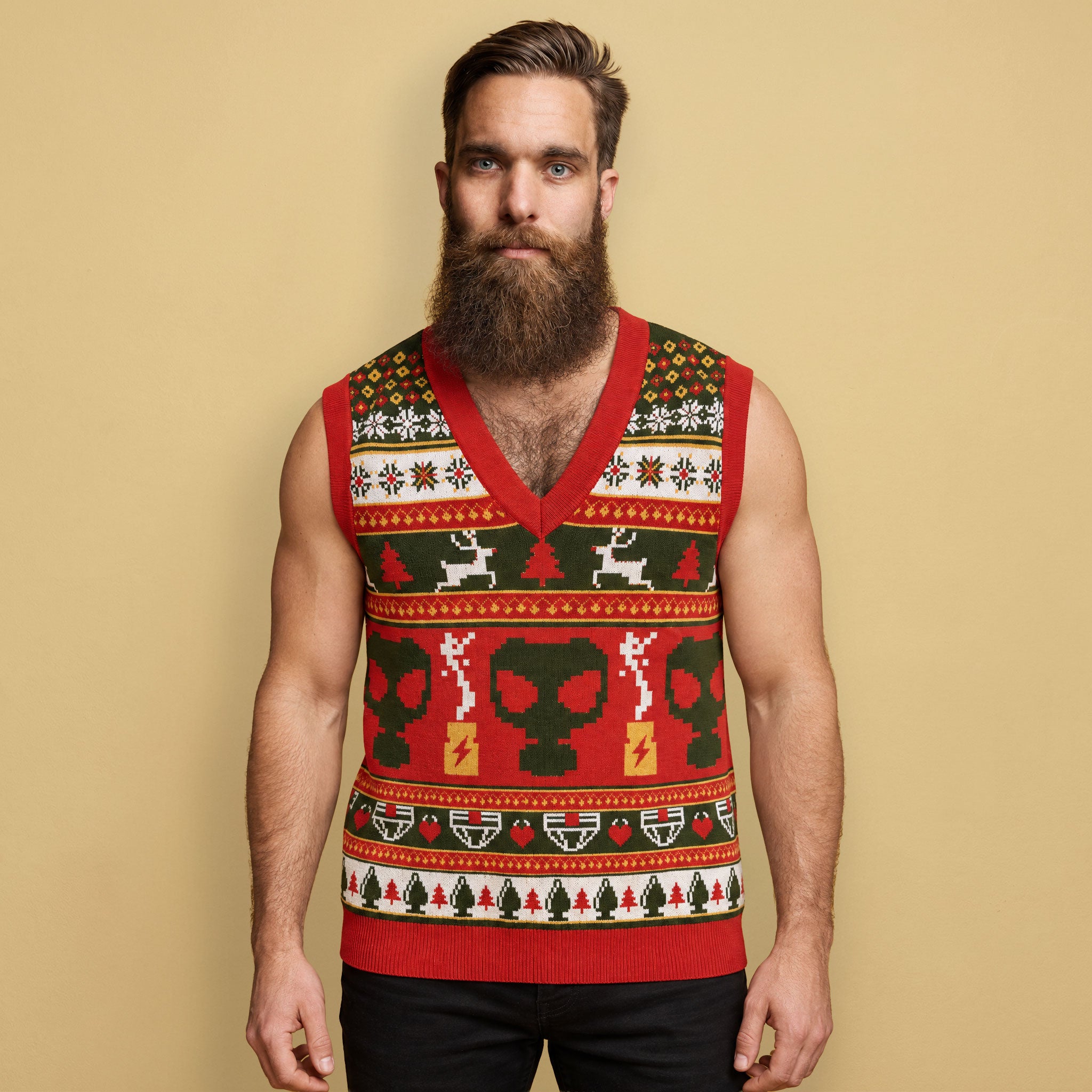 Bearded male model wearing the red and green Backroom Gear Ugly Christmas Sweater Vest against a beige background.