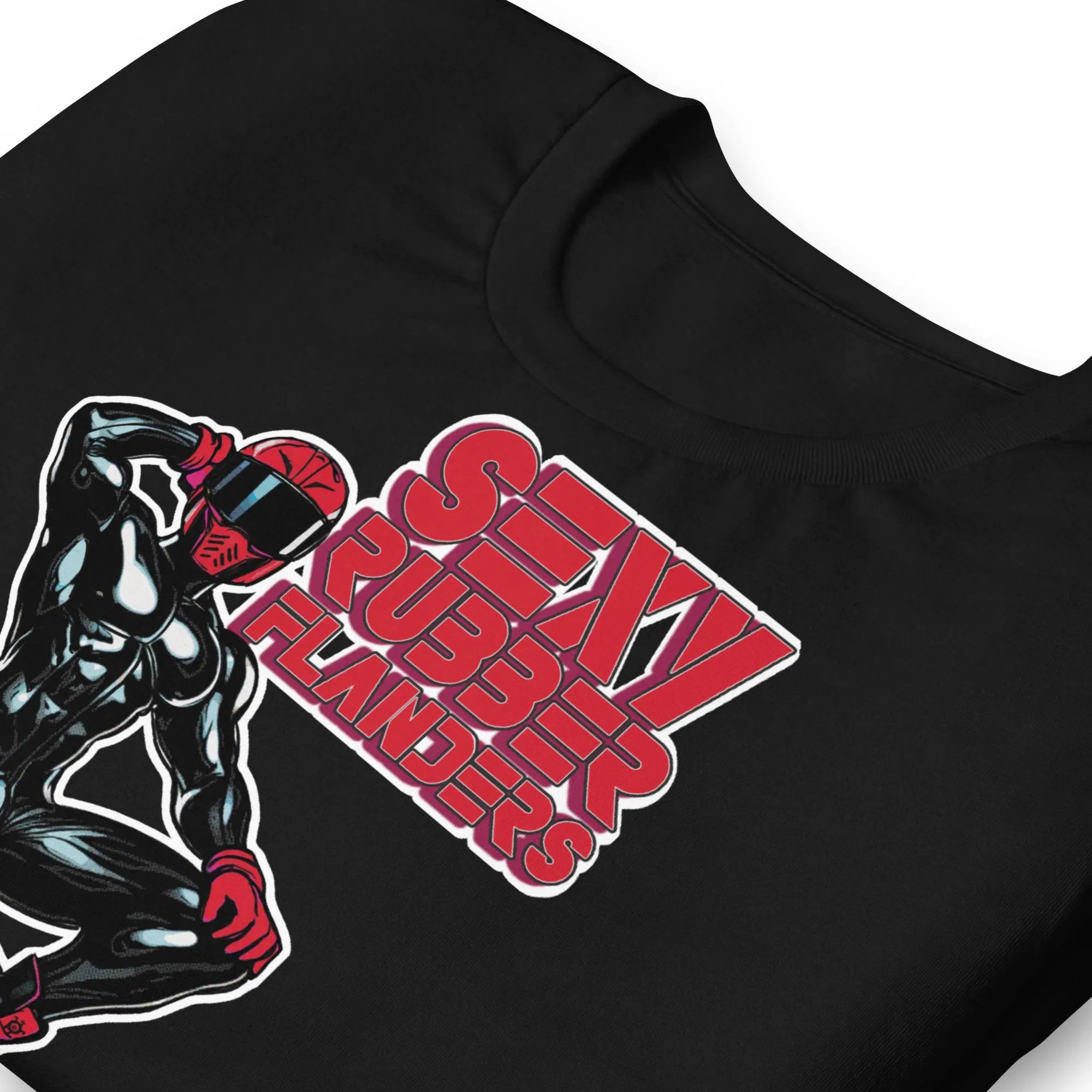 Folded black t-shirt with a man in rubber with red helmet and shoes sitting on top of a square barrel of lube graphic design on a beige background  - Black and red Sexy Rubber Flanders t-shirt - kinky latex rubber kink tee by BackRoomGear