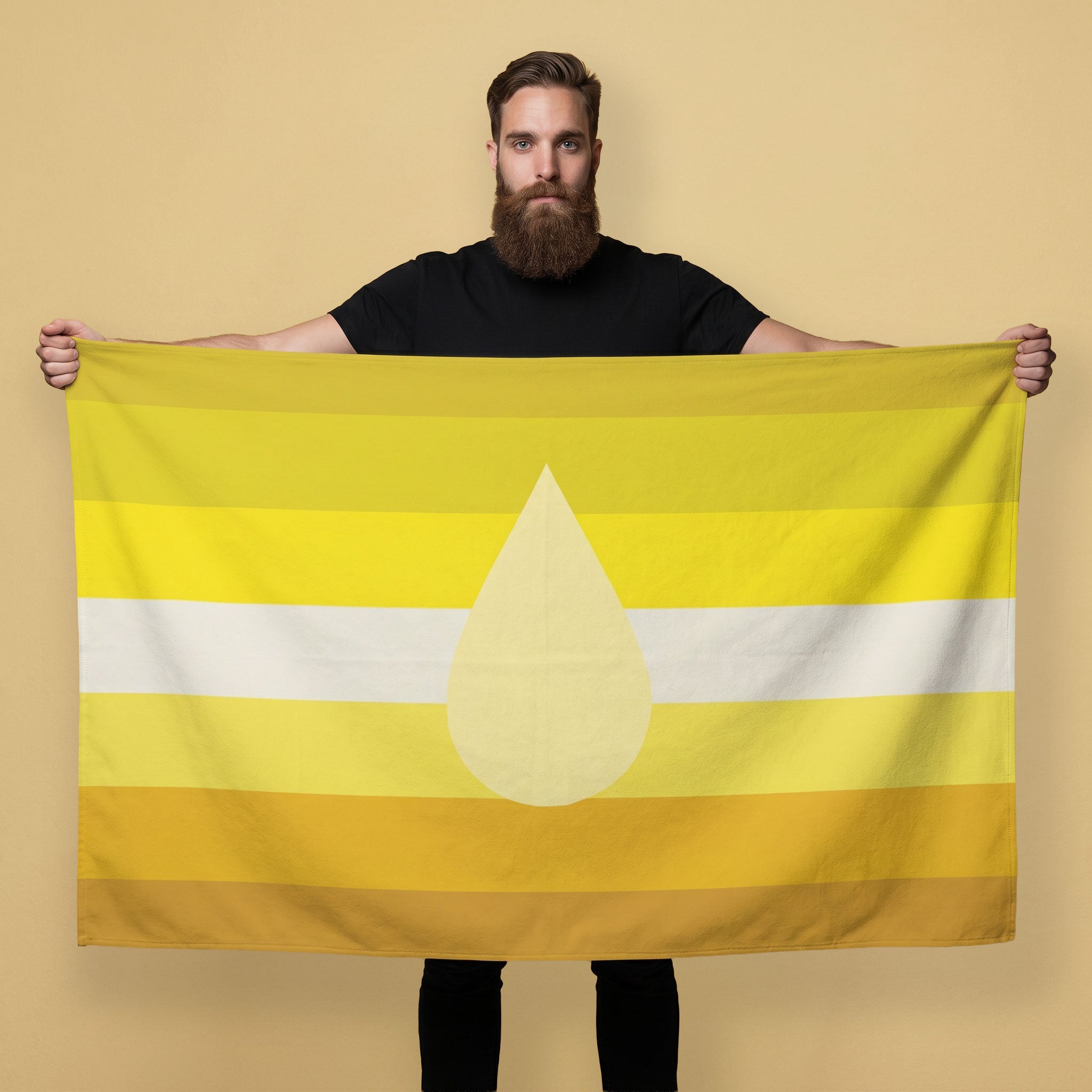 Man holding a vibrant Piss Kink Pride Flag, showcasing bold yellow stripes and a central droplet design.