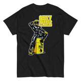 Black shirt featuring a bold and eye-catching designed t-shirt known as the "Sexy Rubber Flanders Fetish Shirt." The shirt displays a striking graphic of a muscle-bound figure in sleek rubber gear, posed confidently atop a barrel labeled "Piss.