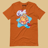 Autumn orange t-shirt with a pool bear graphic and 'Chill' text on a beige background - Bear Pool Pride T-Shirt | Chubby Bear Graphic Tee – Gay pride shirts collection – LGBTQ+ pride t-shirts US UK – Made-to-order gay apparel
